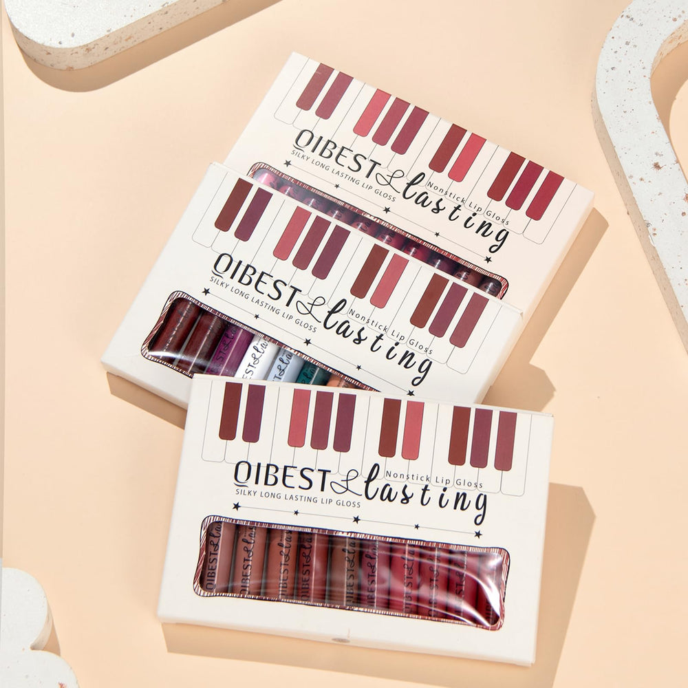 QiBest lipstick next to cup, proves non-stick cup transfer reduction