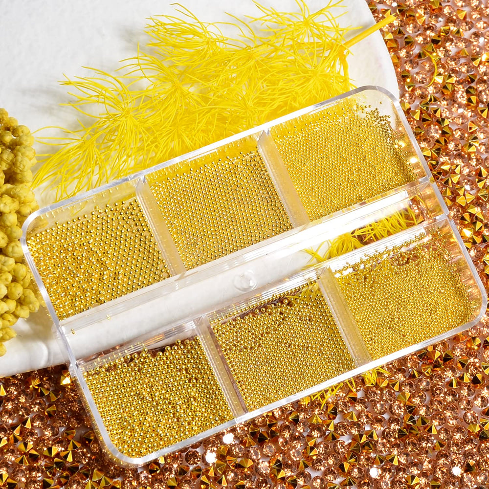QIMYAR acrylic box of gold caviar beads organized for easy use