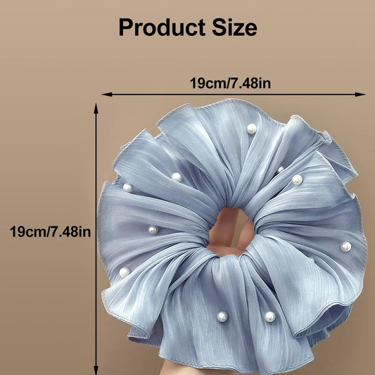 Qojai close-up of pleated satin and riveted pearl detail highlighting refined texture