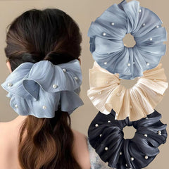 Qojai front view of three satin scrunchies showing color variety and gift-ready look