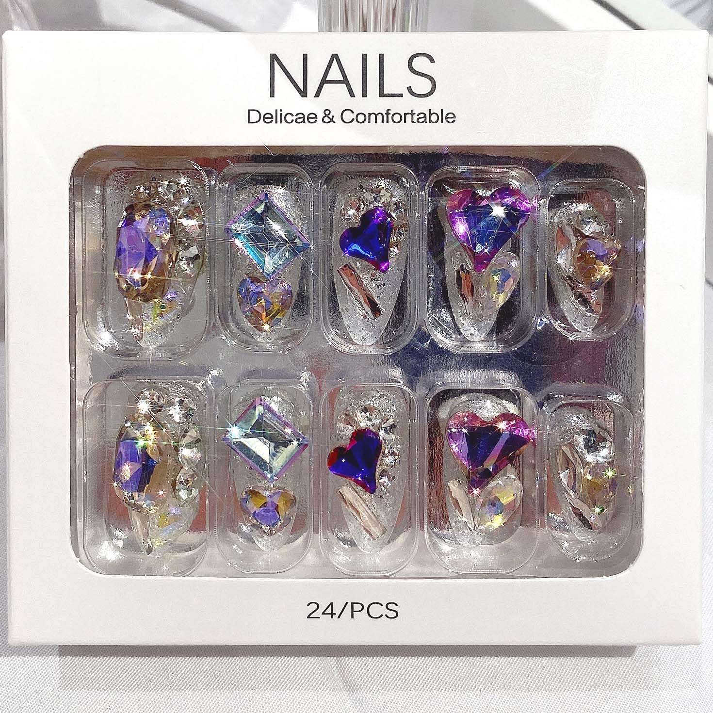 QQPPOLIU nails beside a coin to show scale and wearable medium length