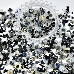 Quezadyl charms placed on acrylic nail swatches demonstrating finished look