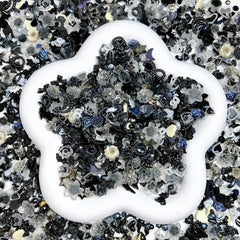 Quezadyl close-up of rose and bow resin charms highlighting texture and shine