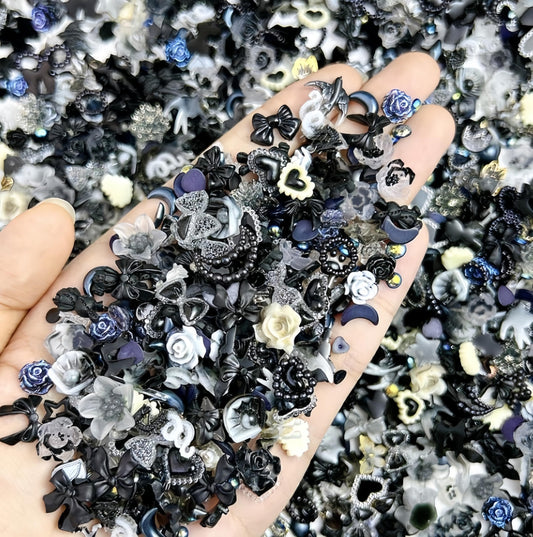 Quezadyl front packaging showing 300-piece resin nail charm assortment for variety