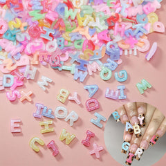 Quezadyl front packaging showing 300 letter charms and colorful variety benefit personalization