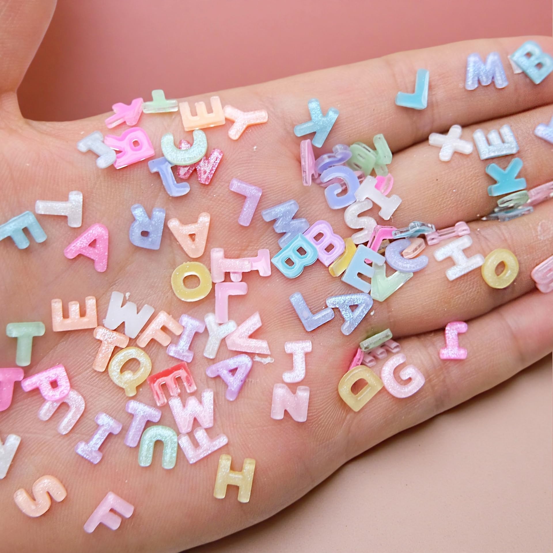 Quezadyl letters placed on a manicured nail tip showing application and custom style benefit