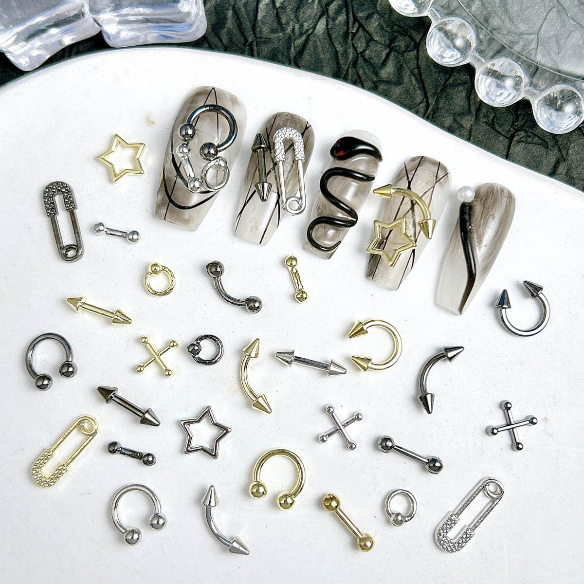 Quezadyl charms next to ruler showing size scale for placement planning