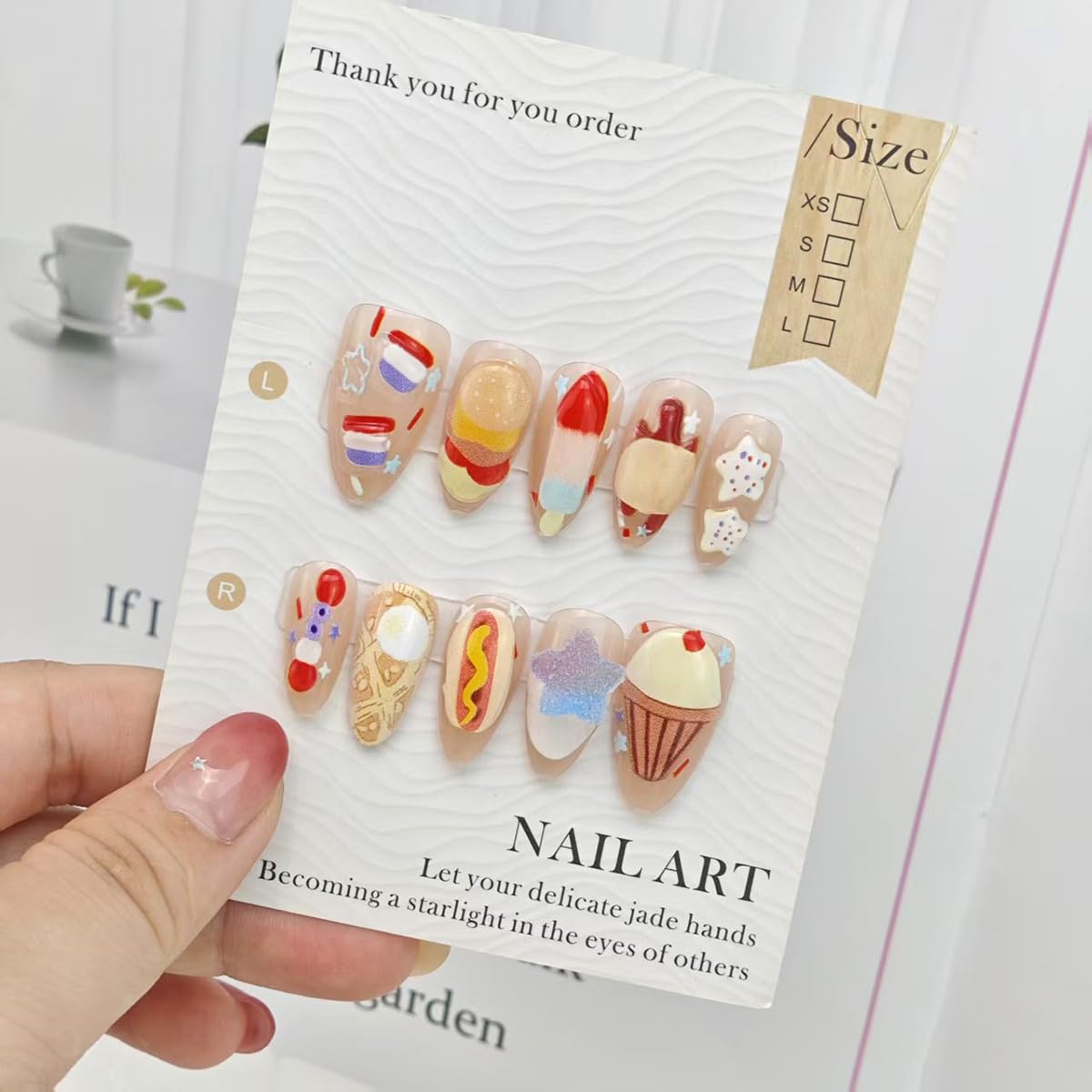 QXFJWRW size layout comparing nails to a finger for fit and scale reference
