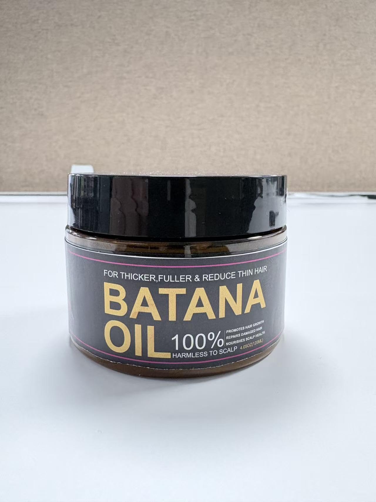 Qytin Batana on bathroom shelf in a natural routine setting to inspire use