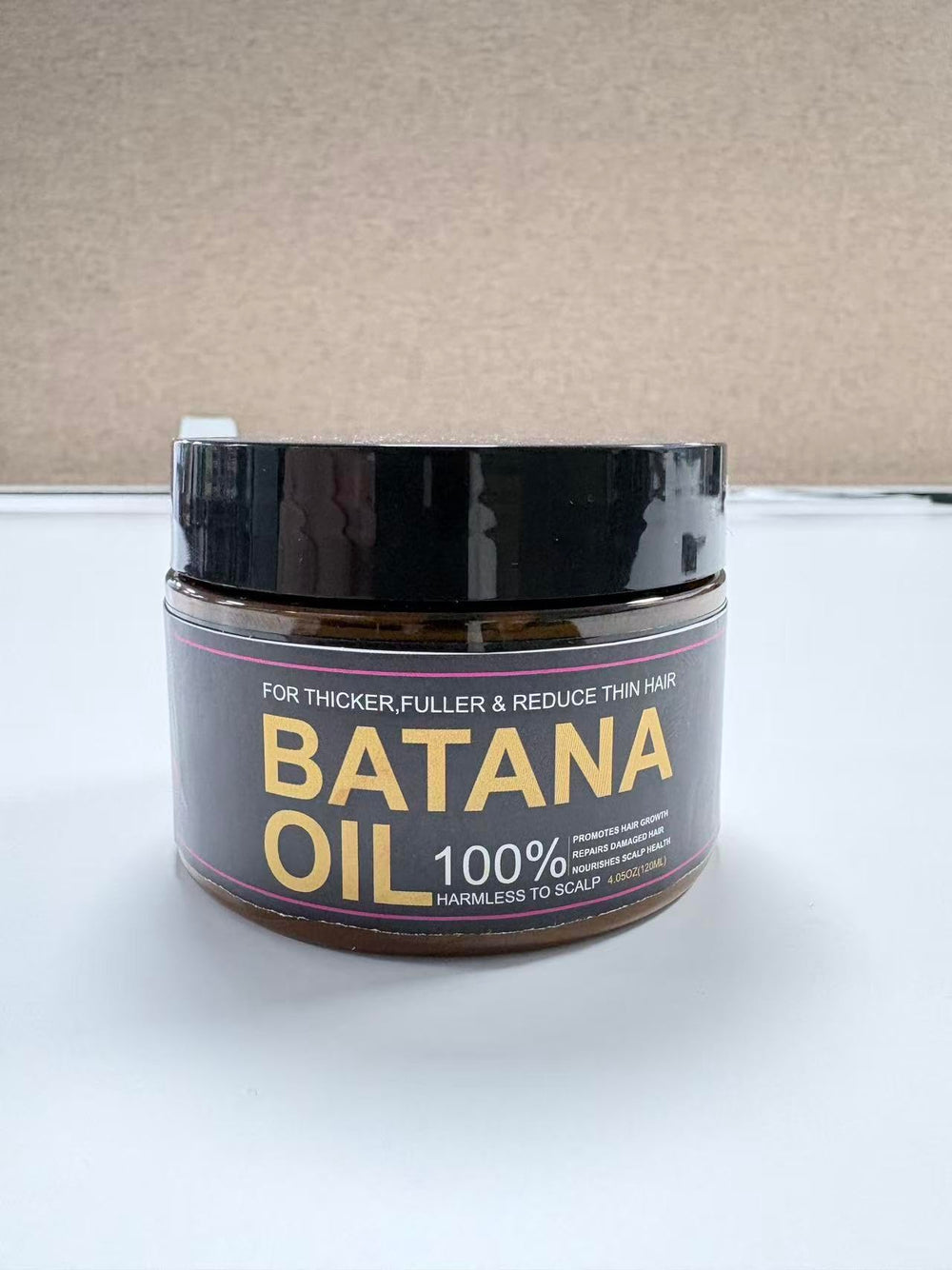 Qytin Batana on bathroom shelf in a natural routine setting to inspire use