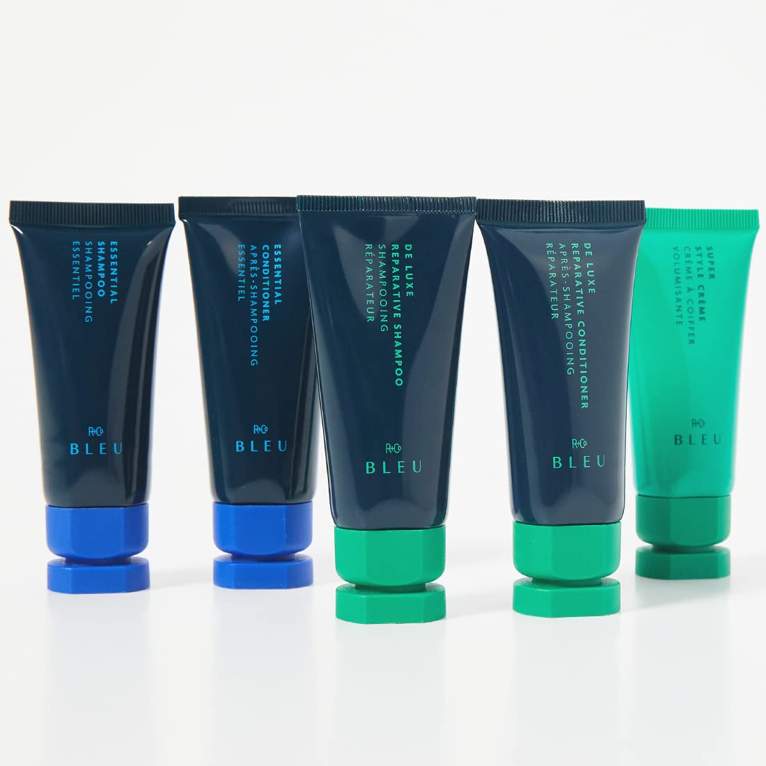 R+Co BLEU De Luxe mini bottle staged in bathroom for convenient travel use