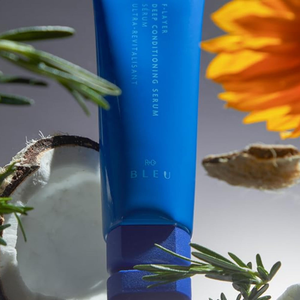 R+Co BLEU beside a ruler indicating 4.2 oz size for scale and travel planning
