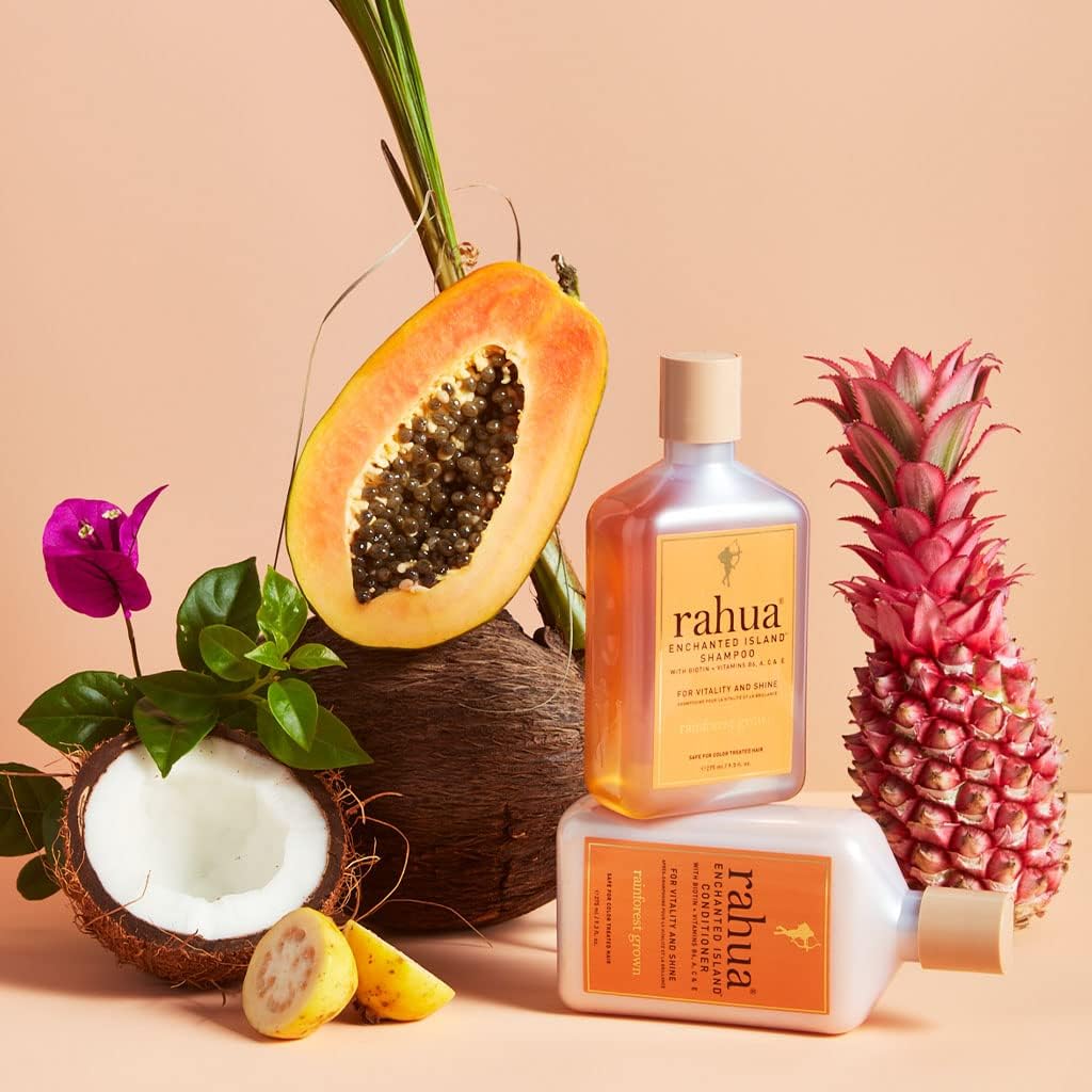 Rahua bottle beside guava and coconut to show tropical scent benefit