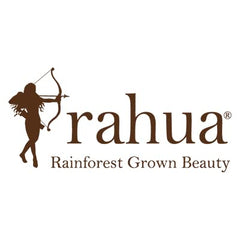 Rahua bottle beside travel bag illustrating easy trip-friendly care