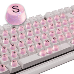 Raised Button front packaging showing 64 pink silicone keycaps and sparkle benefit