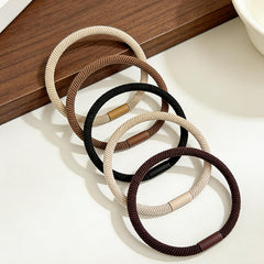 Random Mood hair ties beside ruler for size comparison, compact and travel-friendly