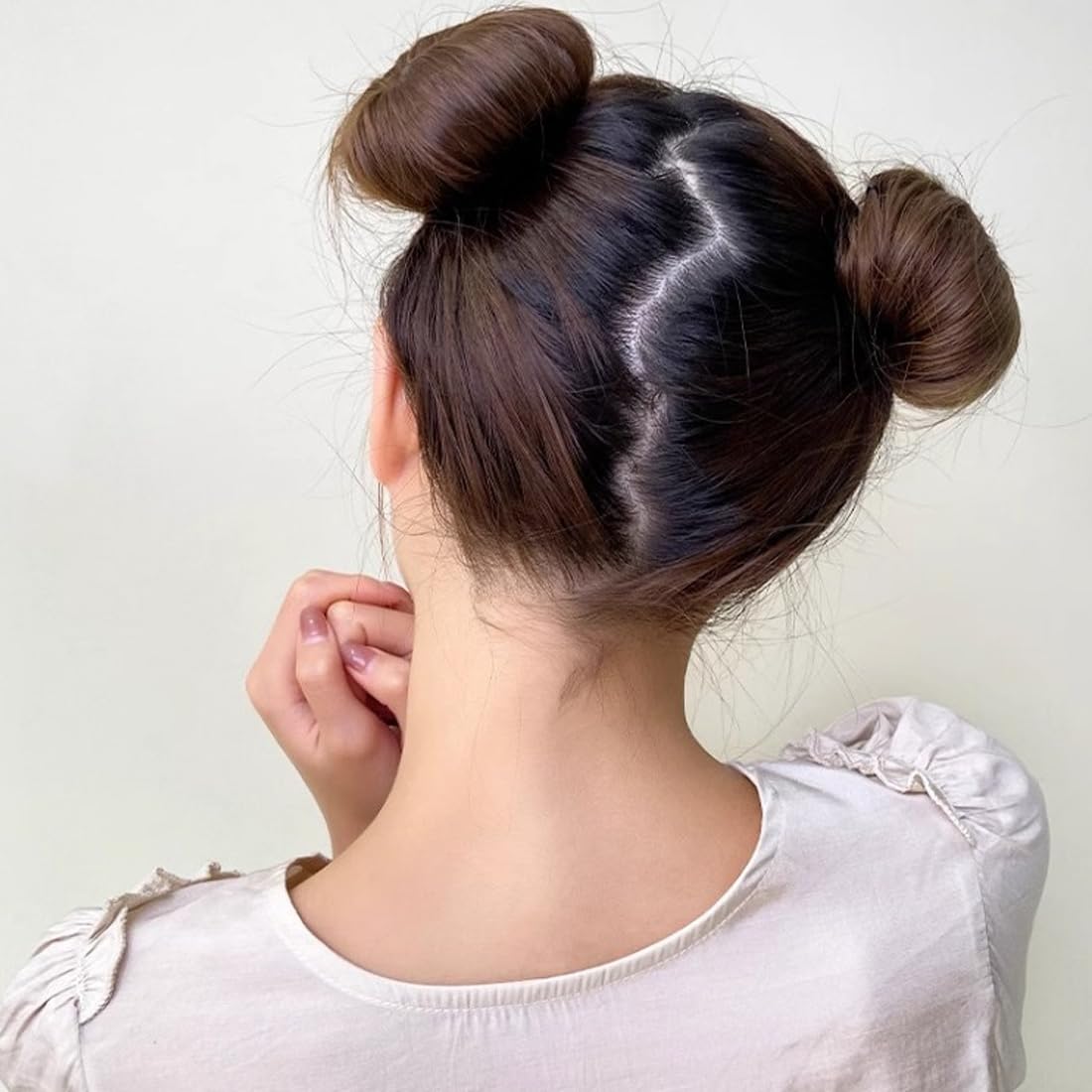 Ravlzors in-use with ponytail inserted, fast bun creation