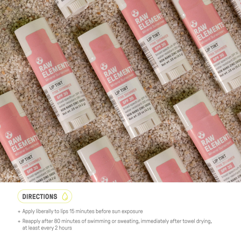 Raw Elements lip shimmer lifestyle on beach showing reef-friendly outdoor protection