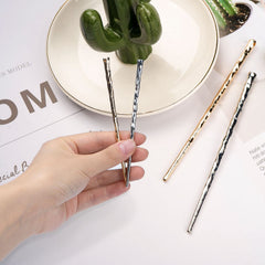 RAYNAG hair sticks securing a classic bun for comfortable all-day wear