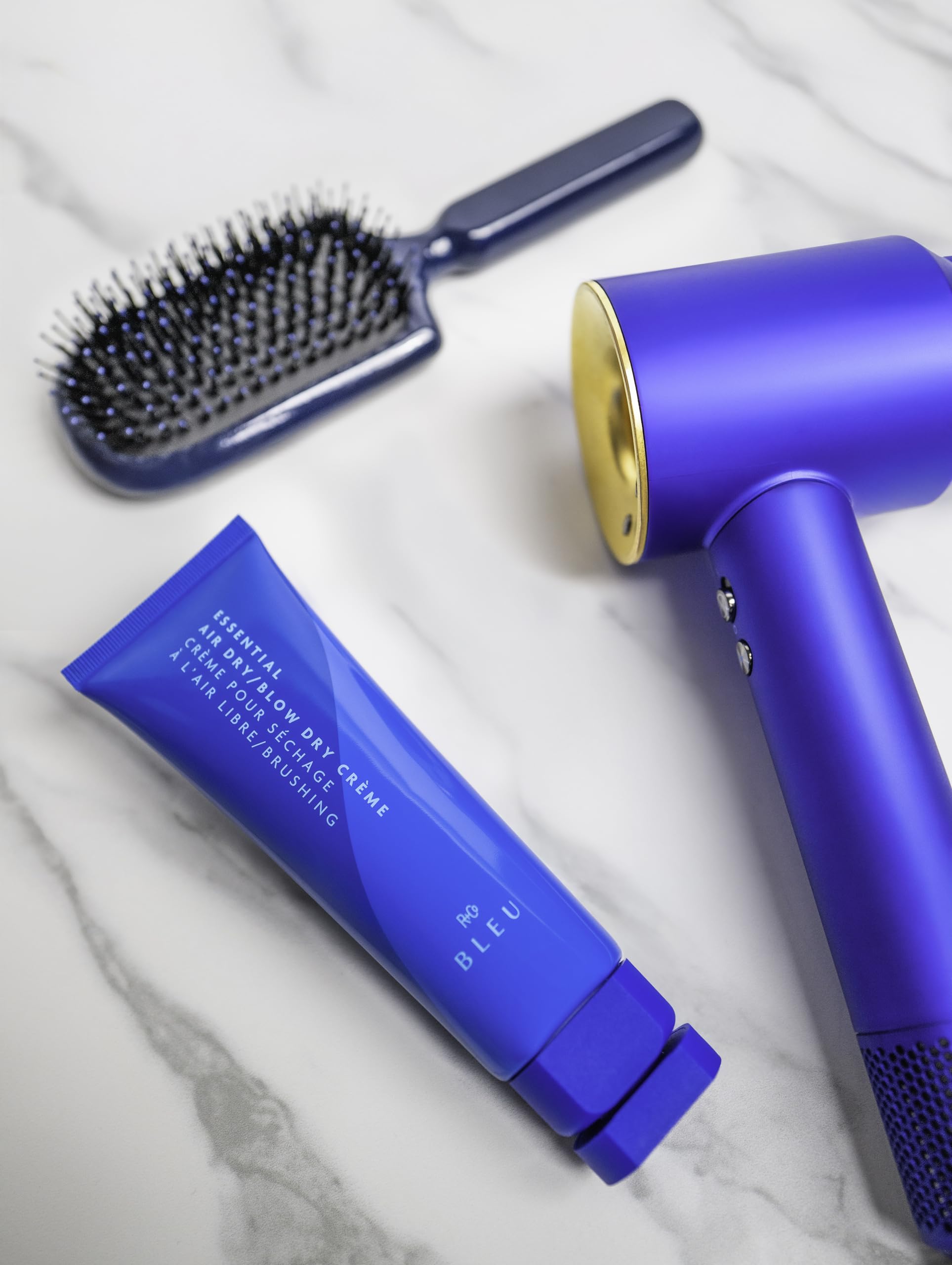 R+Co BLEU being applied to damp hair for detangling