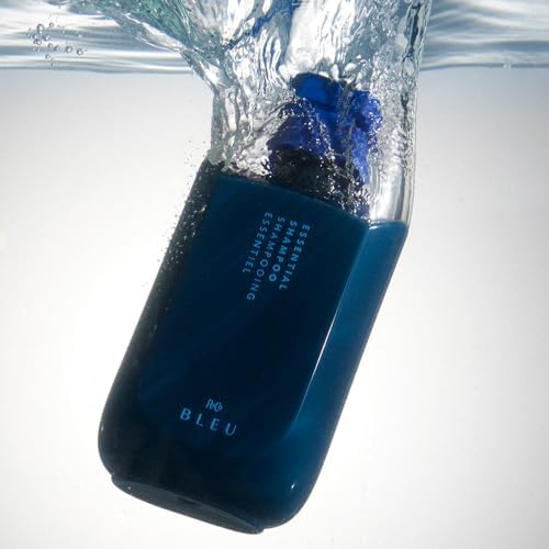 R+Co BLEU bottle beside hairbrush in bathroom scene, conveying daily routine and glossy results