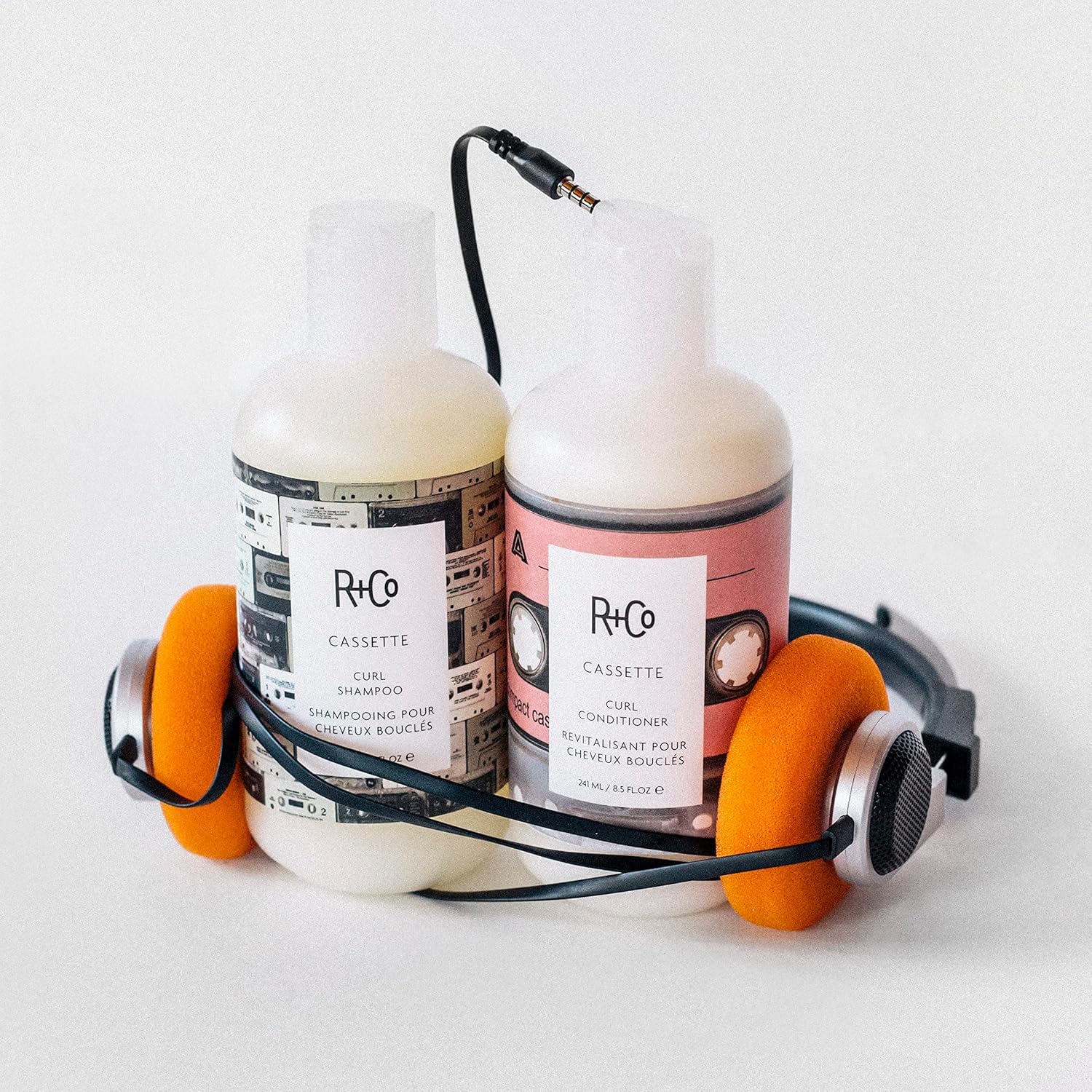 R+Co Cassette in-shower use showing curls being gently detangled and nourished