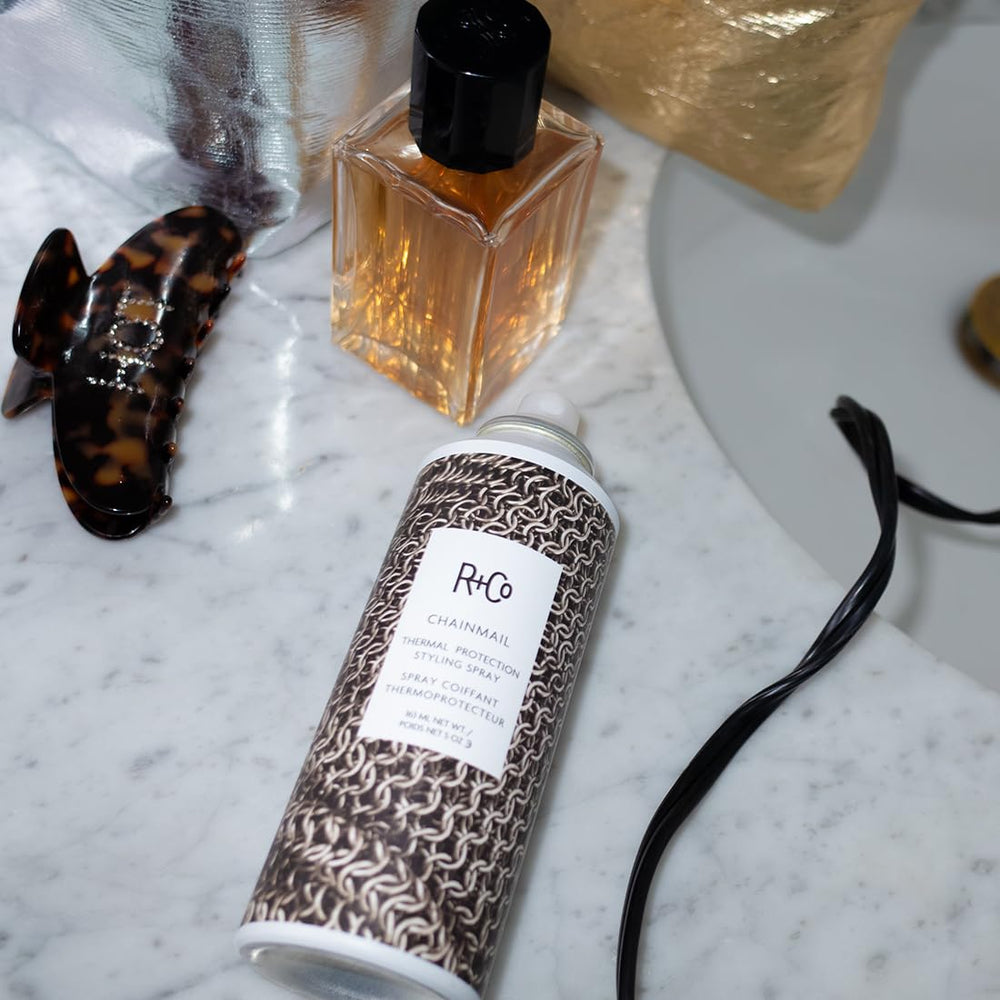 R+Co Chainmail botanical ingredients display highlighting nourishing extracts