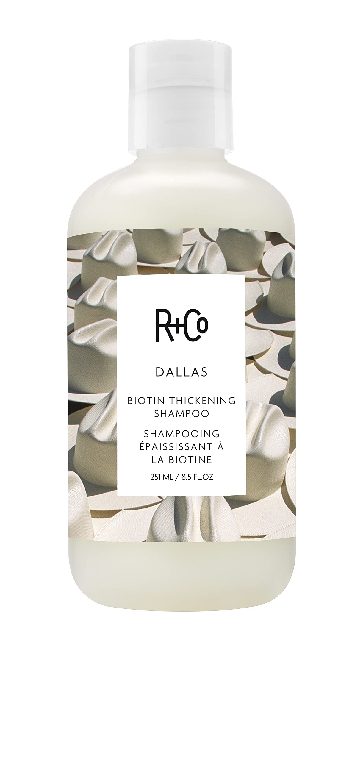 R+Co Dallas front bottle showing sleek packaging and product benefit