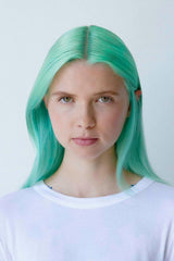 R+Co Gemstone lifestyle model with glossy color-treated hair