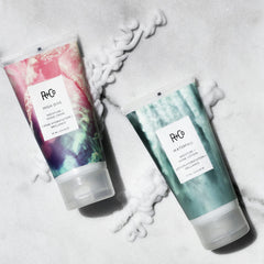 R+Co High Dive applied on hair in hand demonstrating frizz control and easier styling