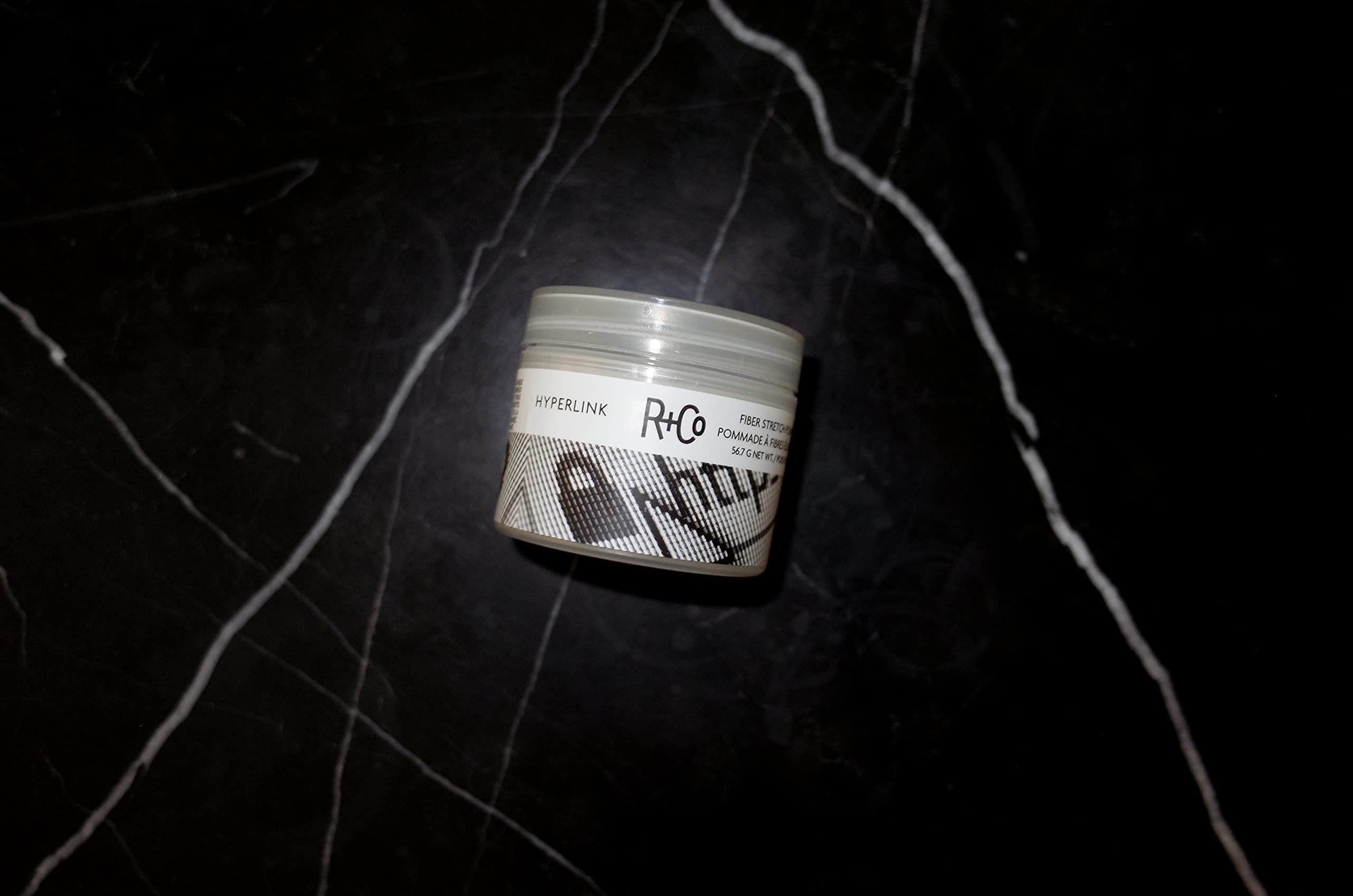 R+Co Hyperlink being warmed in hands demonstrating easy application and flexible hold