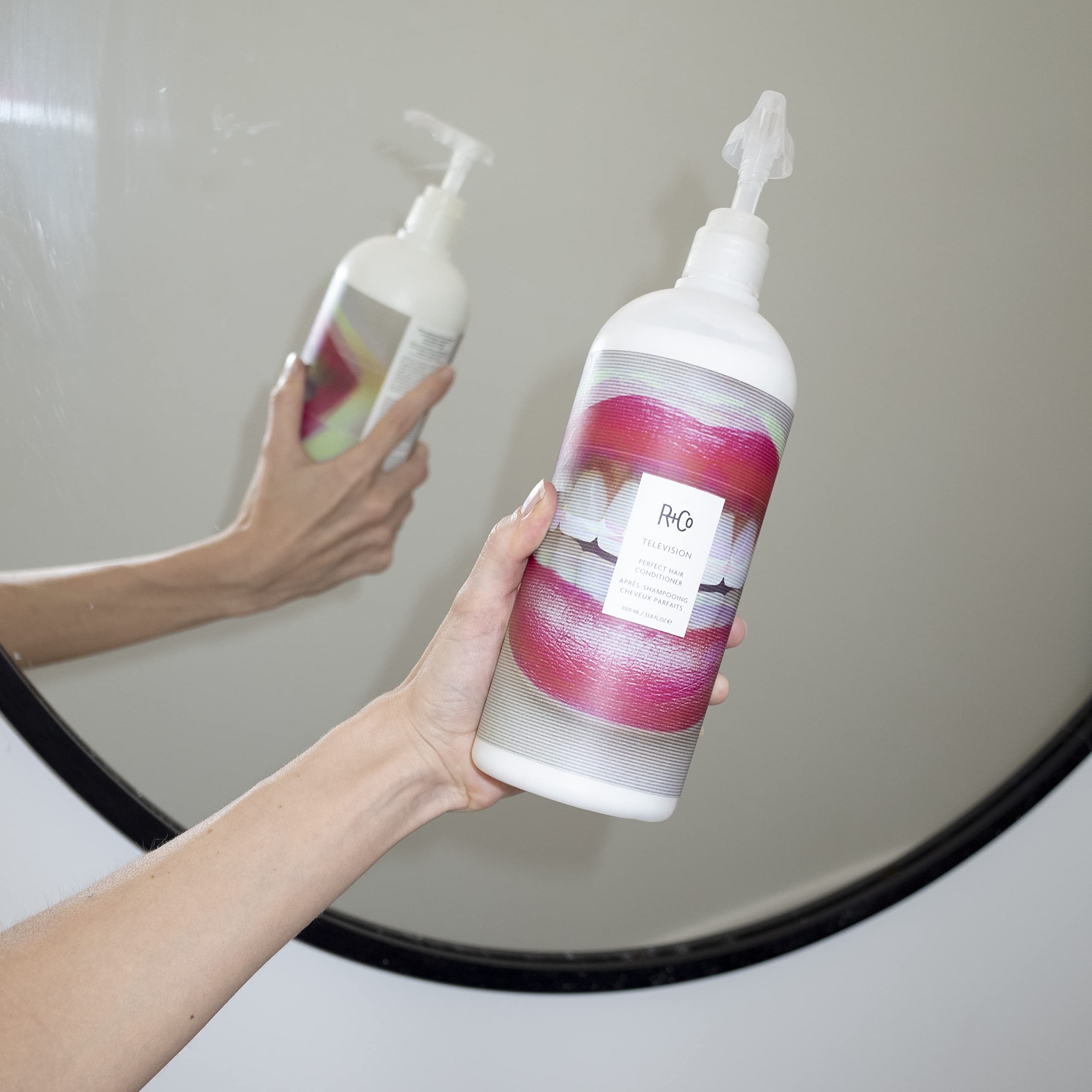 R+Co Television conditioner pump nozzle close-up showing easy dispensing
