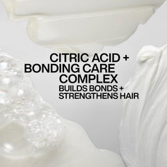 Redken conditioner placed in bathroom setting illustrating daily use and professional results