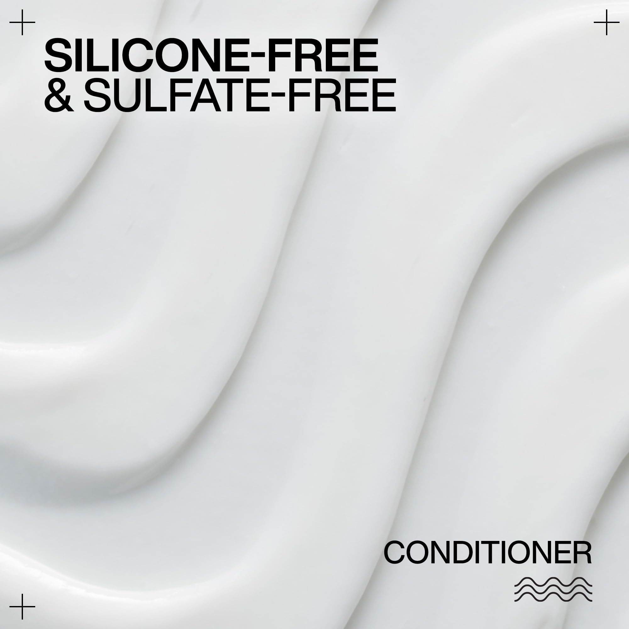 Redken creamy conditioner texture close-up showing smooth hydrating formula
