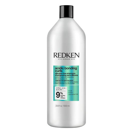 Redken front packaging showing bottle and product name, highlights repair benefits