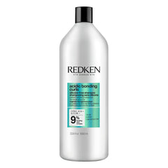 Redken front packaging showing bottle and product name, highlights repair benefits