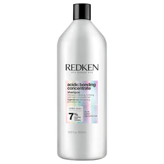 Redken bottle front view showing branding and repair focus benefits