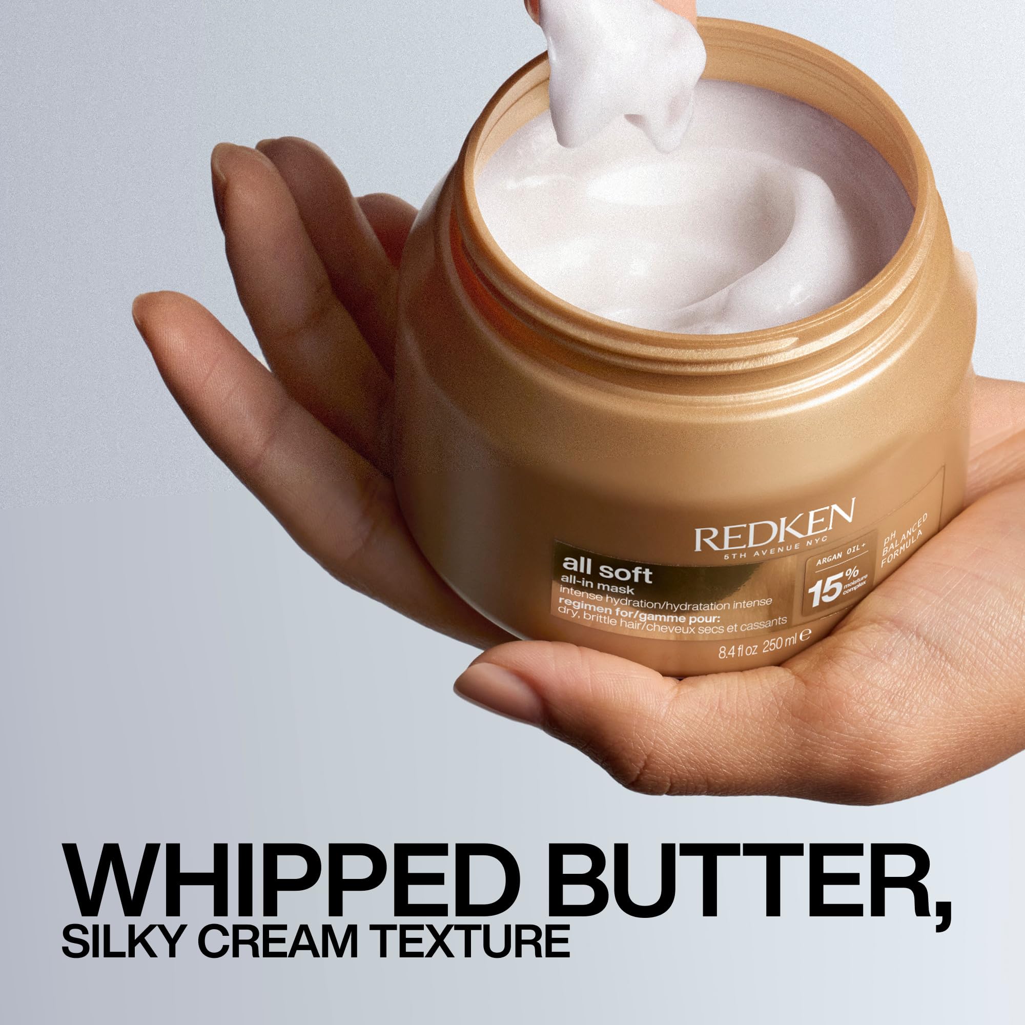 Redken All Soft All-In Mask being applied to wet hair for deep conditioning benefit