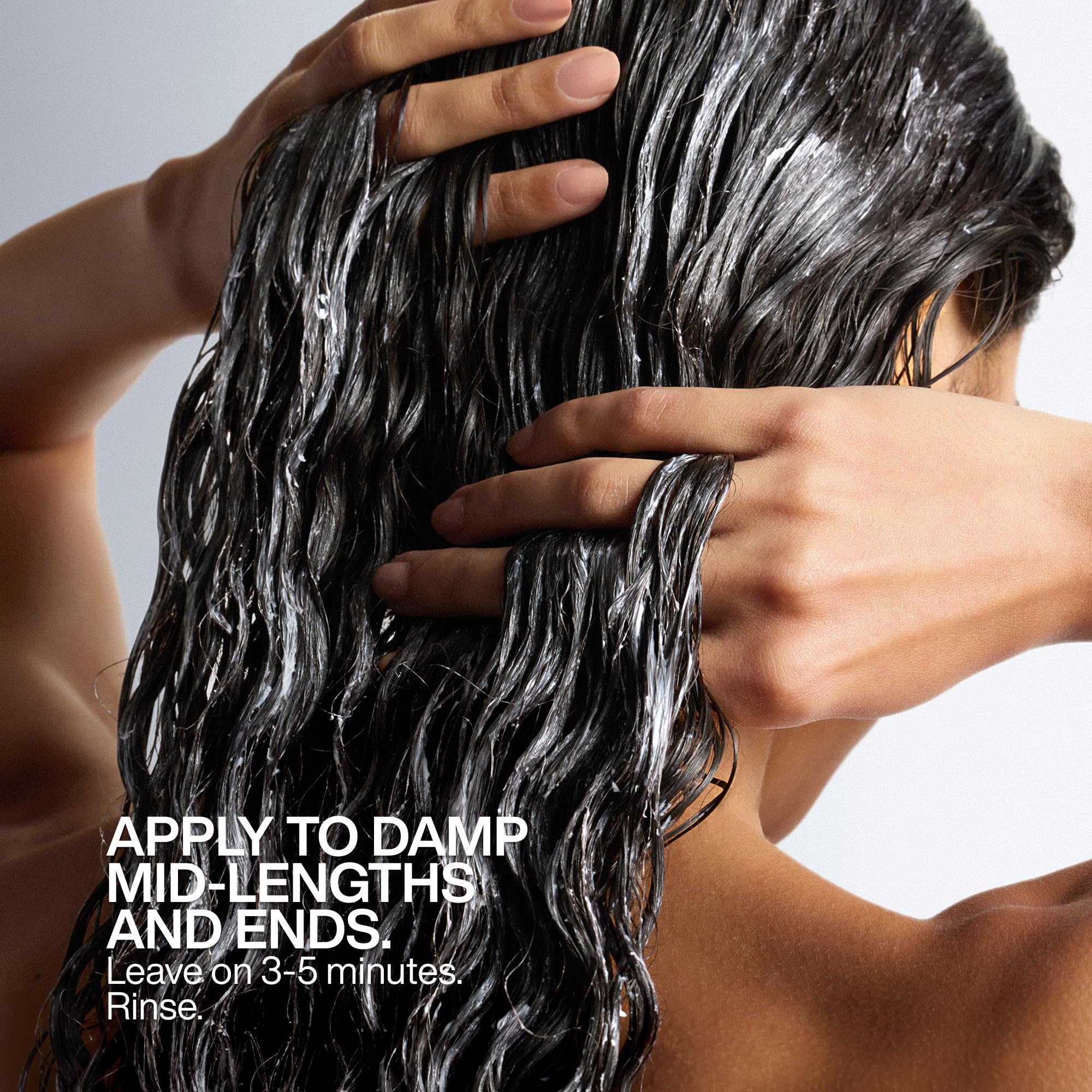 Redken All Soft All-In Mask label close-up displaying ingredient and usage details
