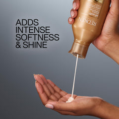 Two Redken All Soft bottles for scale showing size options and convenience