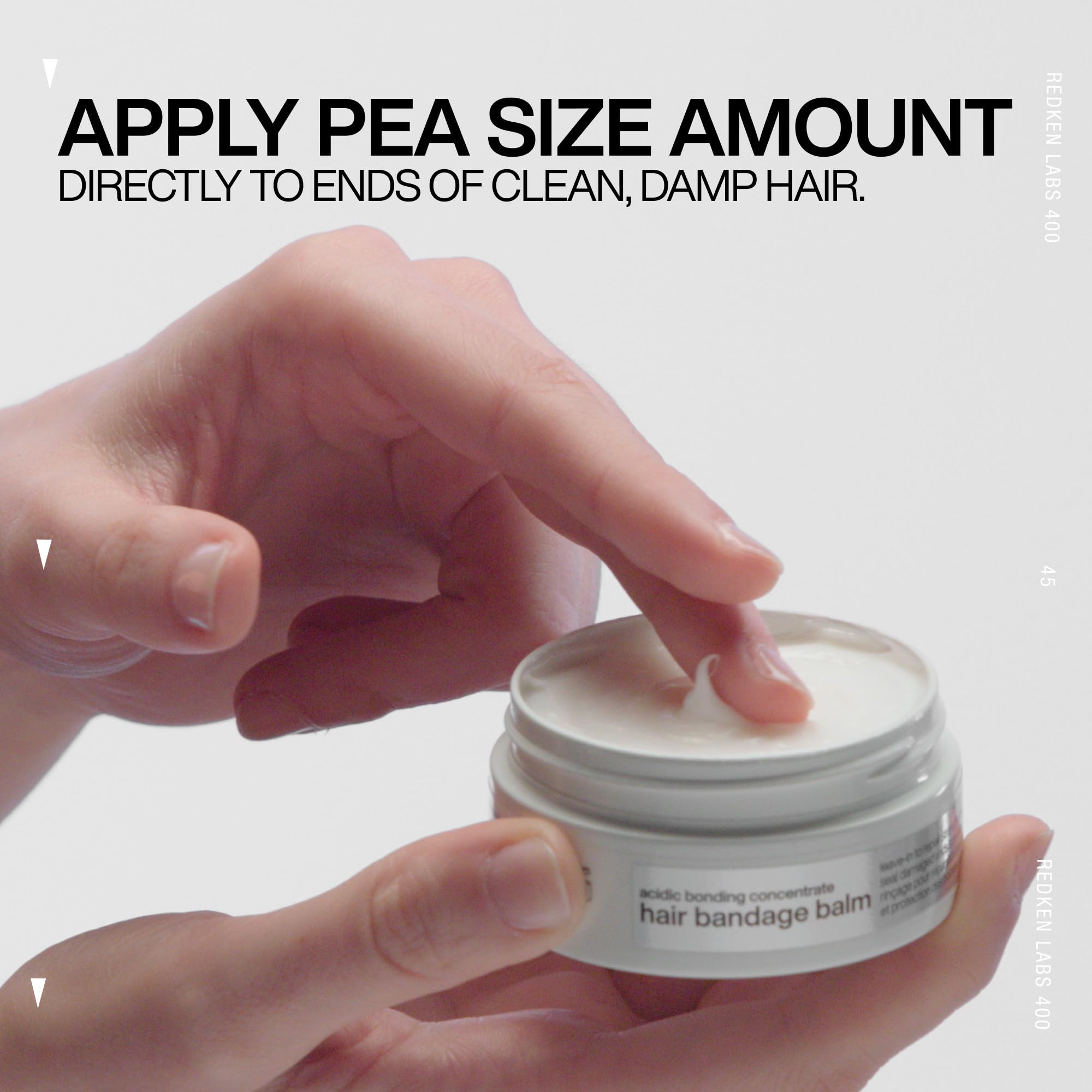 Redken balm dispensed on palm showing recommended small amount