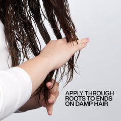 Redken Big Blowout applied to damp hair showing easier comb-through and protection