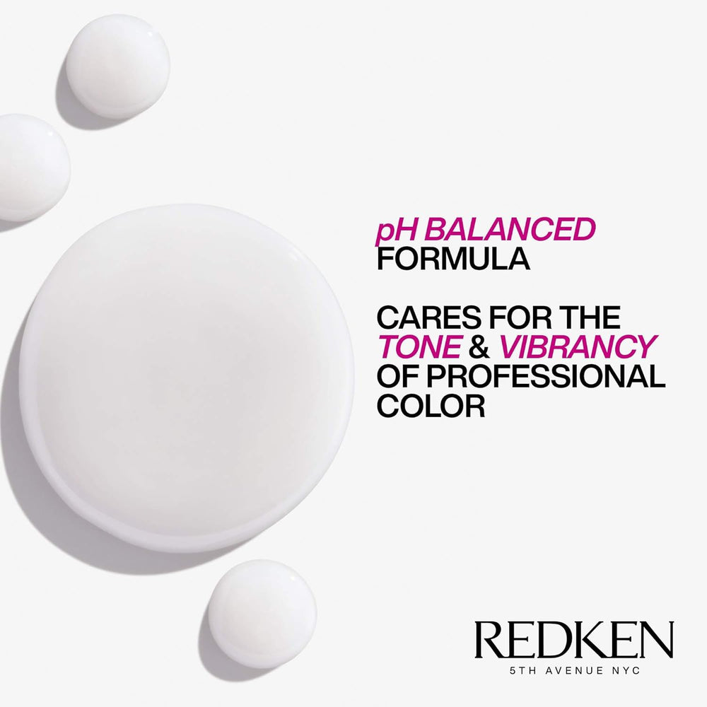Redken bottle styled on bathroom shelf conveying salon-quality home care