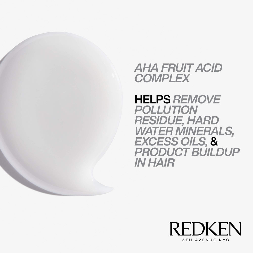 Redken ingredients label close-up highlighting AHA fruit acid and cleansing complex benefits