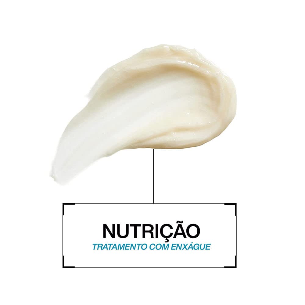 Redken product label close-up showing key ingredients like biotin and niacinamide