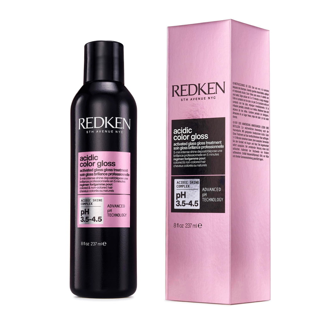 Redken bottle front view showing sleek packaging and professional treatment benefit