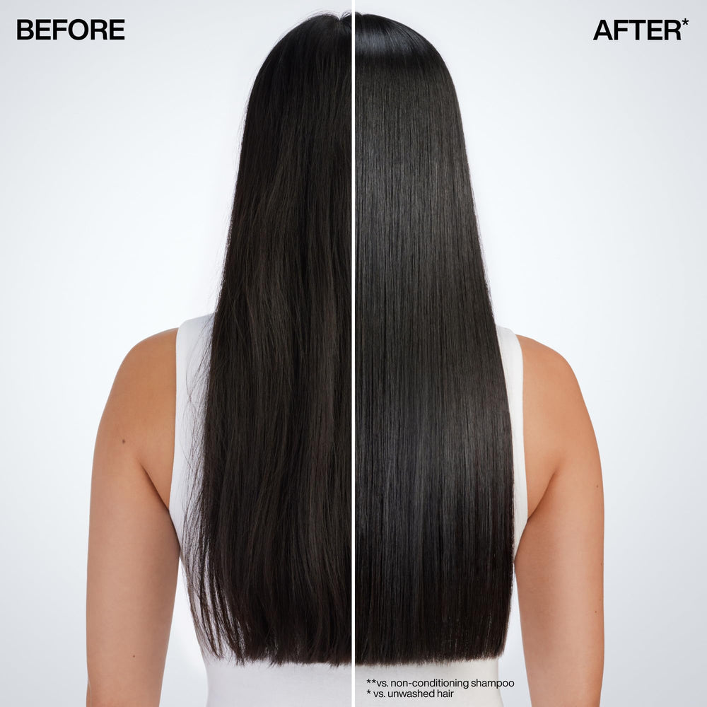 Hand applying Redken mask to towel-dried hair for a quick one-minute treatment