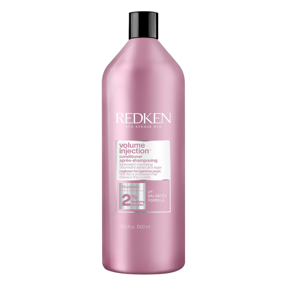 Redken front packaging showing 33.8 fl oz bottle and product benefits