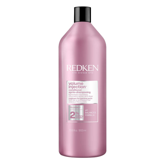 Redken front packaging showing 33.8 fl oz bottle and product benefits