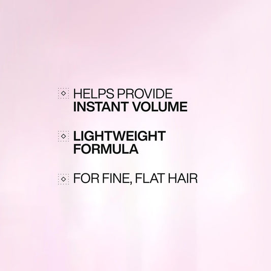 Redken dispensing conditioner pump demonstrating easy salon-style use